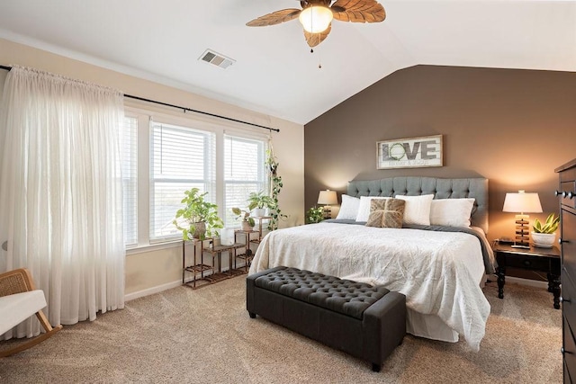 bedroom featuring visible vents, carpet, baseboards, ceiling fan, and vaulted ceiling