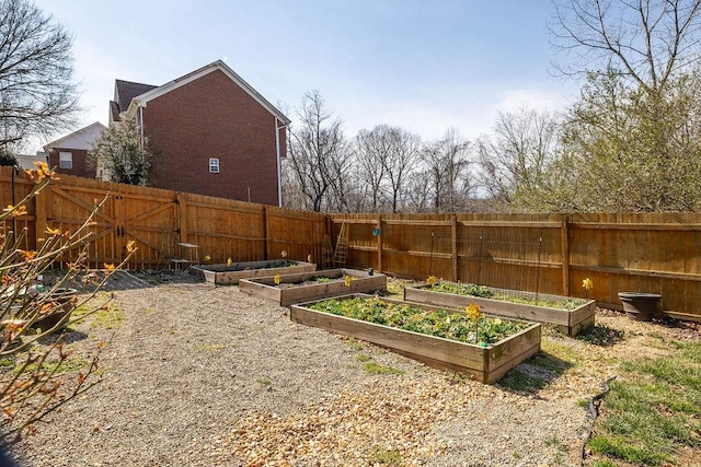 view of yard with a garden and fence