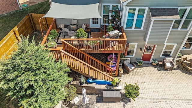 view of patio / terrace featuring stairway, a wooden deck, and fence