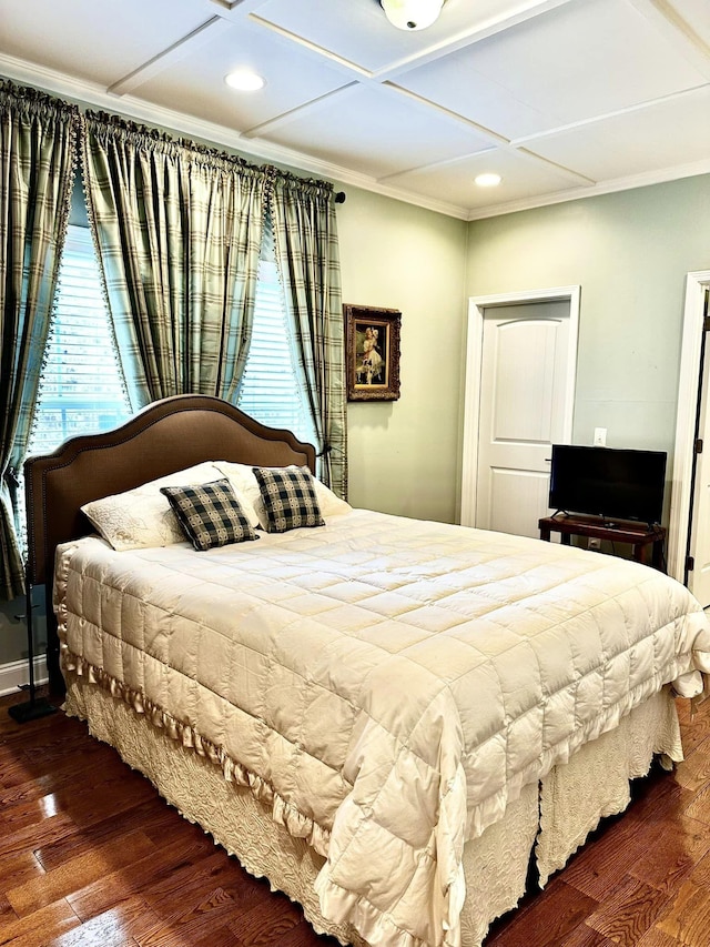 bedroom with dark wood-type flooring, recessed lighting, crown molding, and coffered ceiling