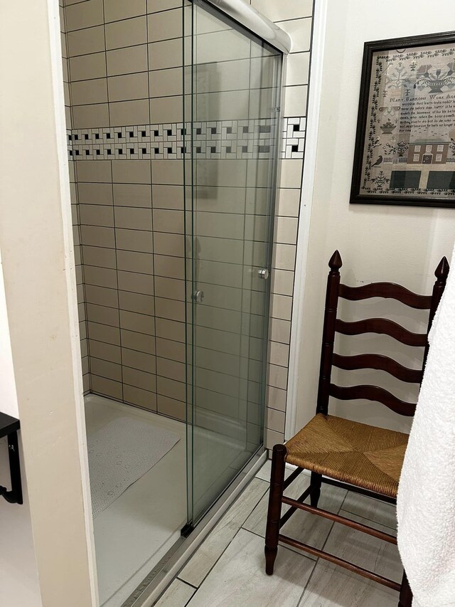 bathroom with a shower stall