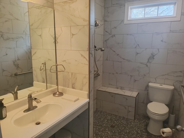 full bath with tile walls, a walk in shower, toilet, and vanity