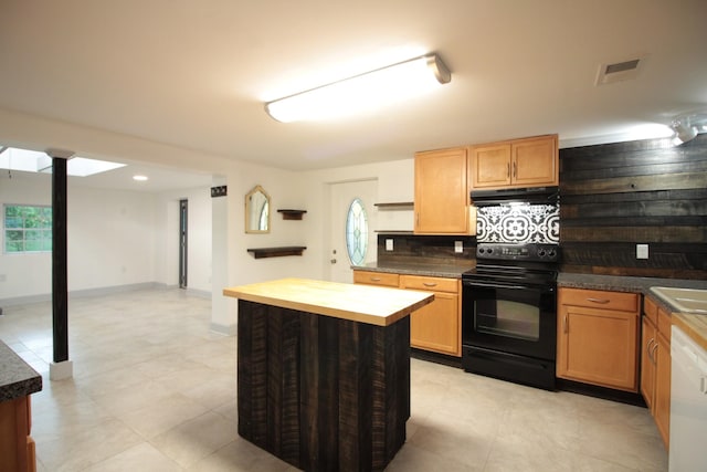 kitchen with visible vents, white dishwasher, black electric range, under cabinet range hood, and tasteful backsplash