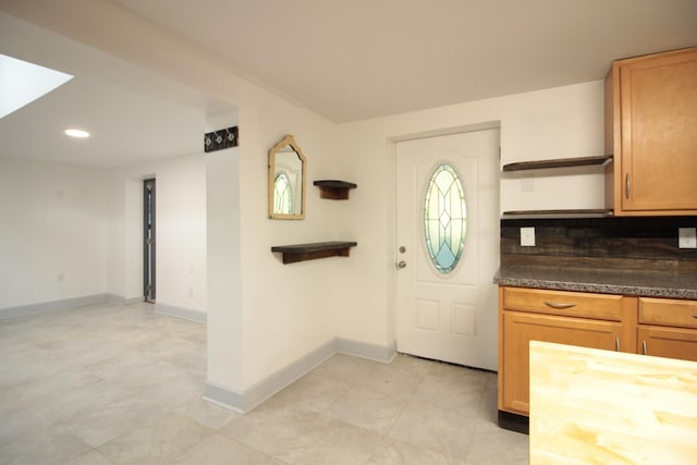 entryway featuring recessed lighting and baseboards