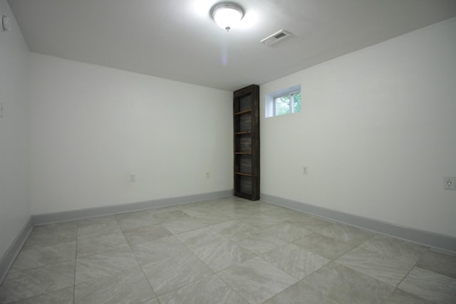 spare room with visible vents and baseboards