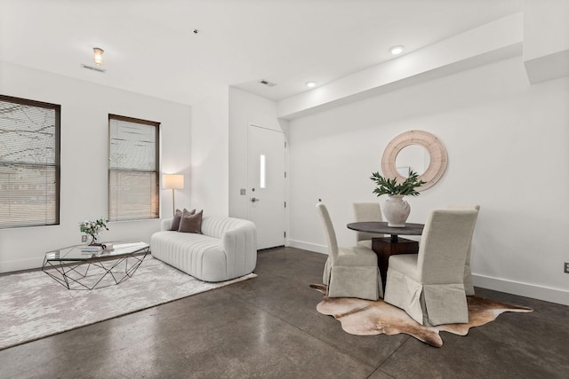 dining space with recessed lighting, finished concrete floors, visible vents, and baseboards