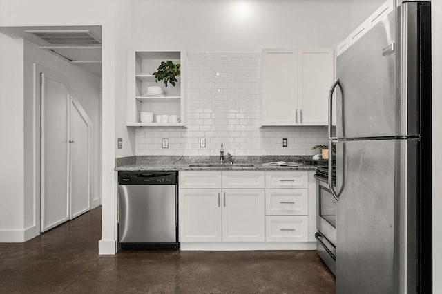 kitchen featuring visible vents, a sink, finished concrete flooring, white cabinetry, and stainless steel appliances