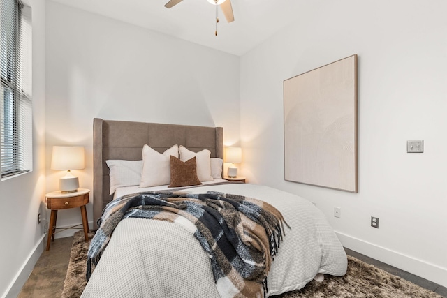 bedroom featuring ceiling fan and baseboards