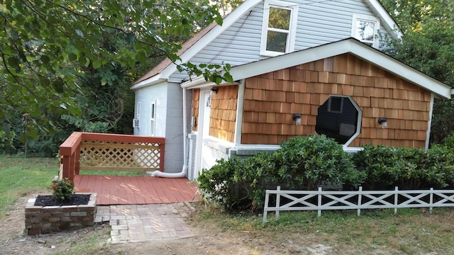 view of outbuilding featuring fence