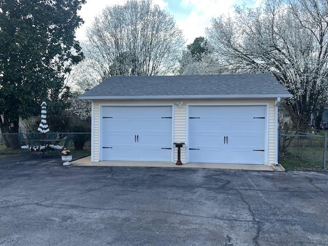 detached garage with fence