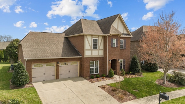 view of front of house featuring concrete driveway, a front yard, a shingled roof, a garage, and brick siding