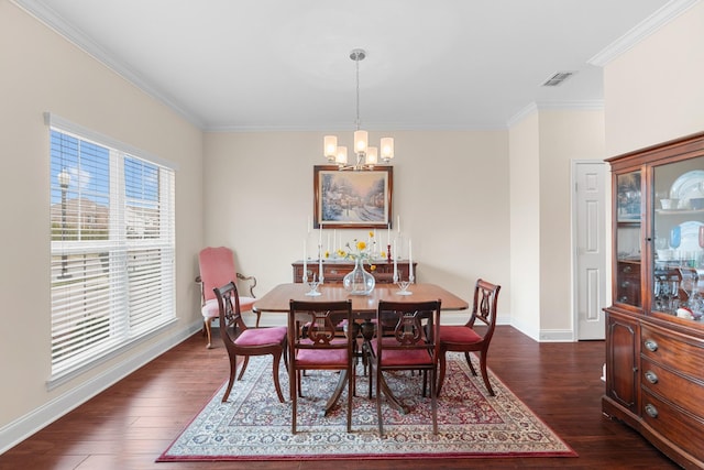 dining space with an inviting chandelier, visible vents, dark wood-style flooring, and ornamental molding