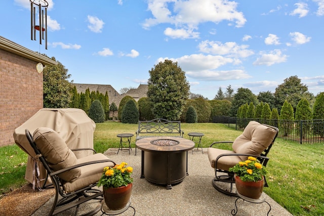 view of patio featuring fence and an outdoor fire pit