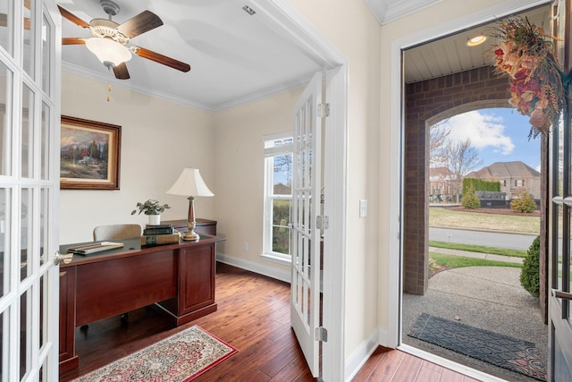 foyer with baseboards, hardwood / wood-style floors, ornamental molding, french doors, and a ceiling fan