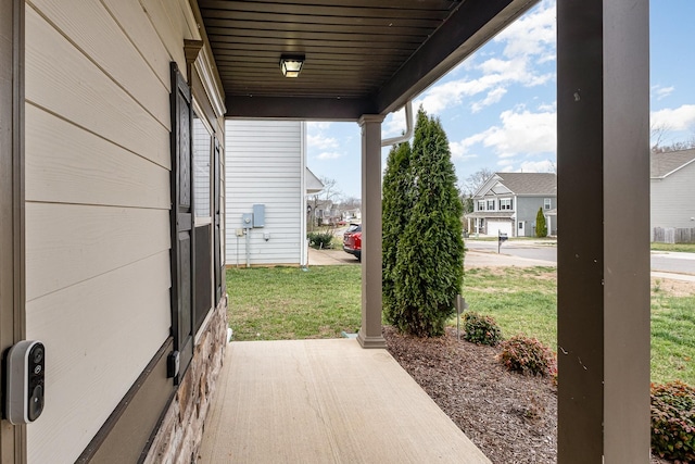 view of patio featuring a porch and a residential view