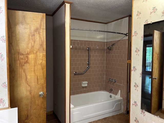 full bathroom featuring tile patterned flooring, shower / washtub combination, wallpapered walls, and a textured ceiling