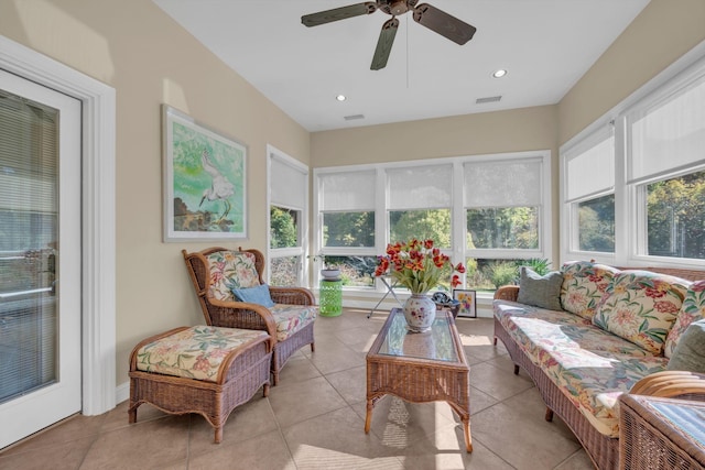 sunroom with visible vents and a ceiling fan