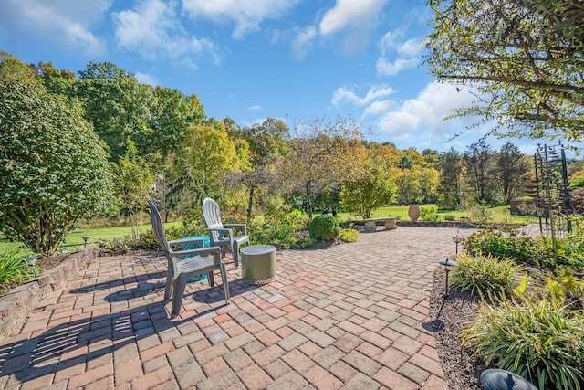 view of patio with a fire pit