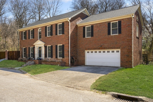 view of front of property featuring a garage, brick siding, driveway, and fence