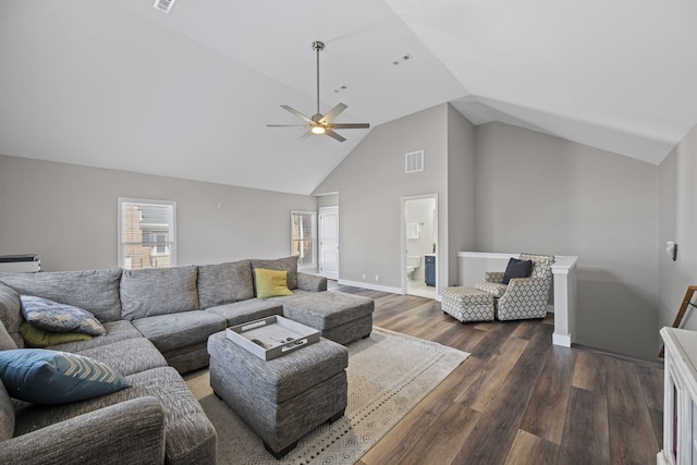 living room with visible vents, high vaulted ceiling, a ceiling fan, dark wood finished floors, and baseboards