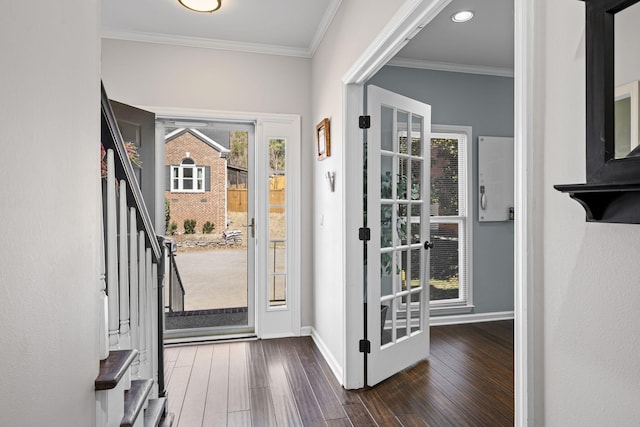 foyer entrance featuring stairs, crown molding, and dark wood-style flooring