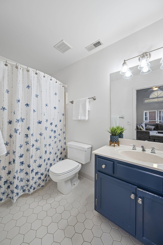 full bathroom with visible vents, connected bathroom, toilet, and vanity