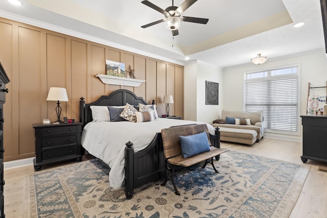 1321 Highgrove Ln, Clarksville, TN 37043 - bedroom with light wood-style flooring, recessed lighting, a tray ceiling, crown molding, and a ceiling fan