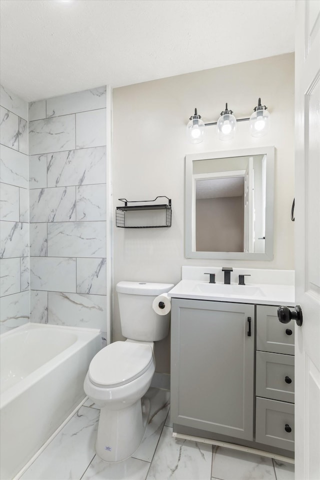 bathroom featuring vanity, a textured ceiling, shower / bathing tub combination, toilet, and marble finish floor