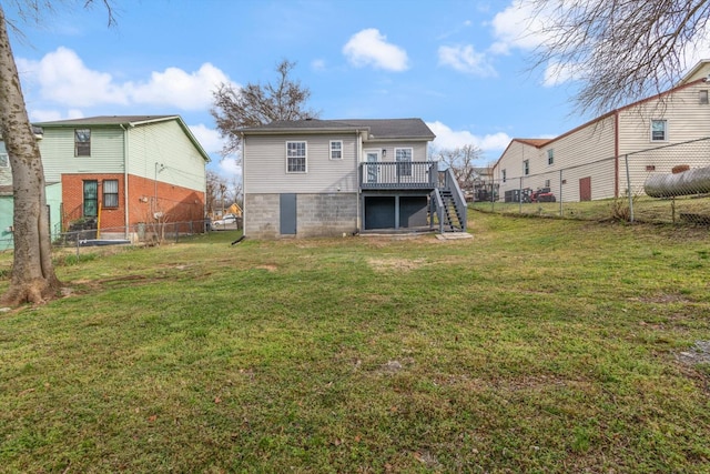 back of house with a yard, a deck, stairs, and fence