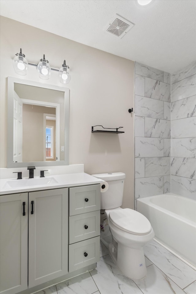 full bathroom featuring visible vents, toilet, marble finish floor, shower / bath combination, and vanity