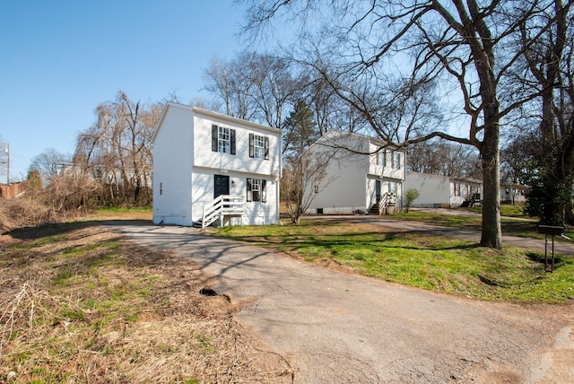 colonial-style house with driveway