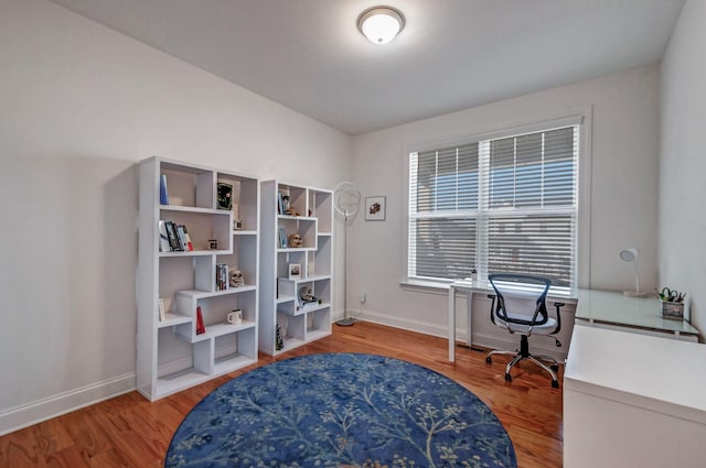 office with baseboards and wood finished floors