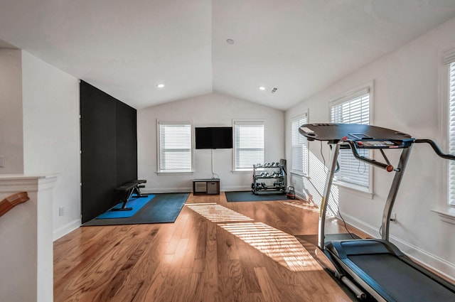 workout room with recessed lighting, baseboards, lofted ceiling, and wood finished floors