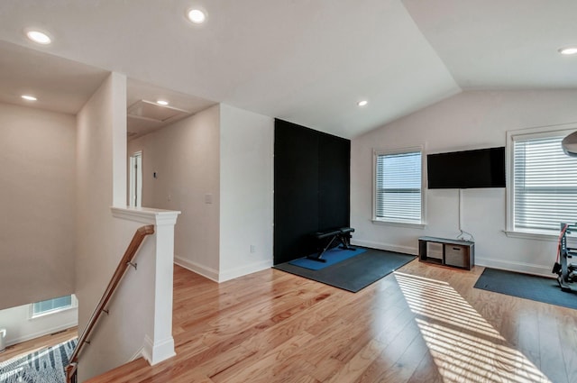 workout room featuring a wealth of natural light, visible vents, and light wood-style flooring