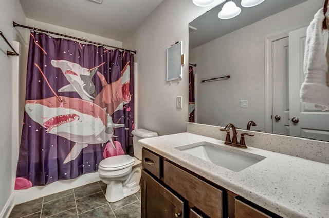 bathroom featuring tile patterned floors, toilet, and vanity