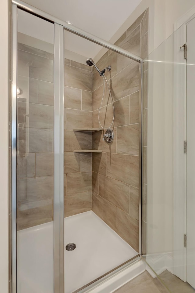 bathroom featuring a shower stall