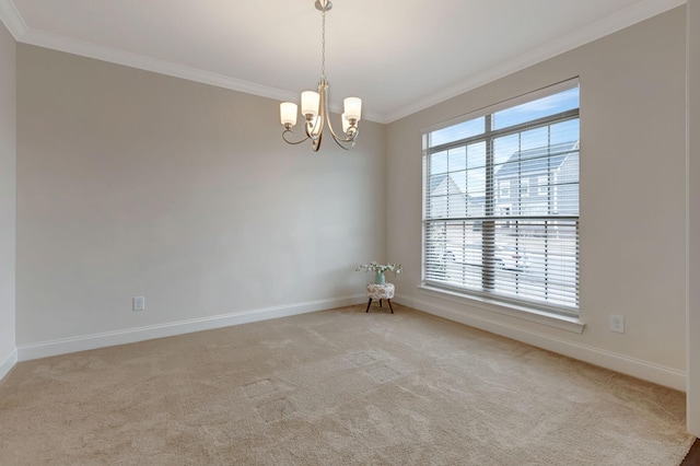 empty room featuring an inviting chandelier, ornamental molding, baseboards, and light carpet