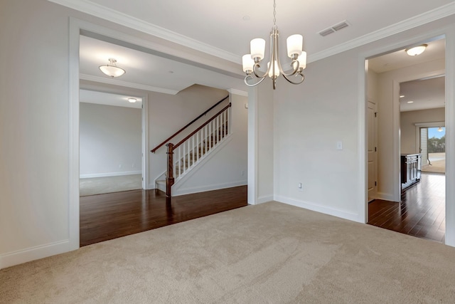 carpeted empty room with stairs, crown molding, baseboards, and visible vents