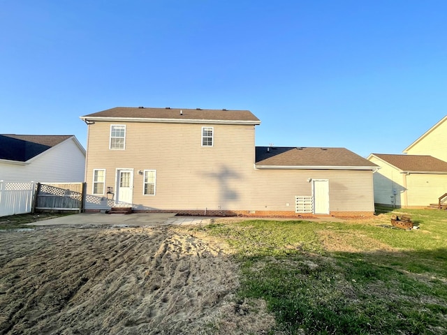 rear view of property with a patio area, a lawn, entry steps, and fence