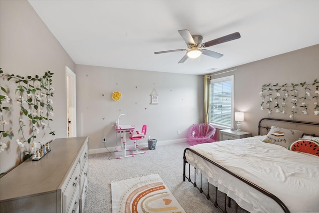 bedroom with ceiling fan, baseboards, and light carpet