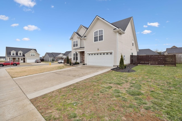 view of home's exterior featuring fence, a yard, concrete driveway, a garage, and a residential view