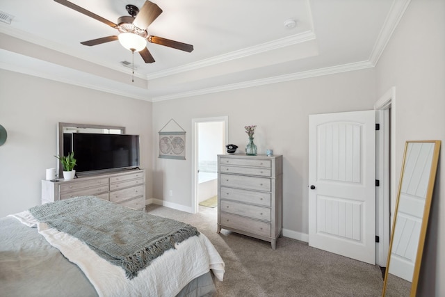 bedroom with a tray ceiling, light carpet, baseboards, and crown molding