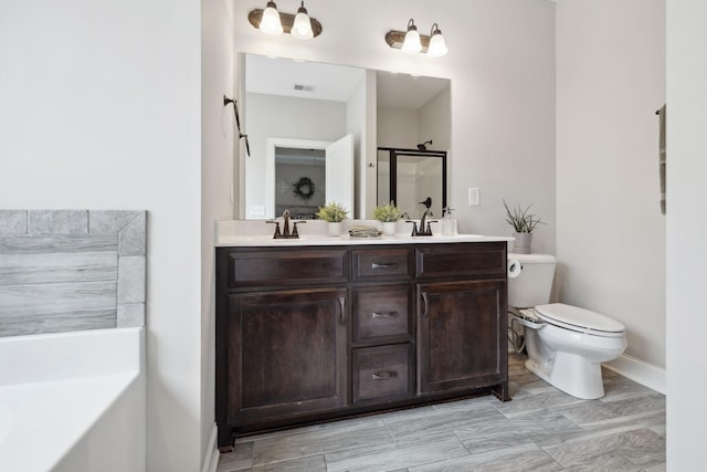 full bath with double vanity, a sink, a garden tub, toilet, and a shower with door