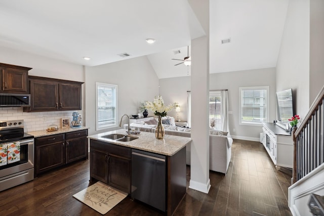 kitchen featuring range hood, visible vents, ceiling fan, a sink, and appliances with stainless steel finishes