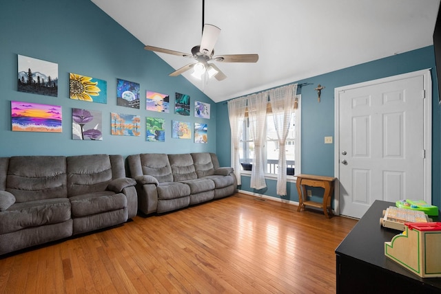 living room featuring light wood-style flooring, baseboards, high vaulted ceiling, and ceiling fan