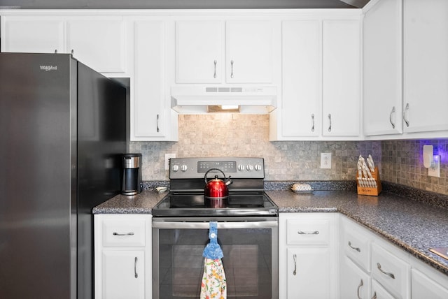 kitchen featuring under cabinet range hood, backsplash, dark countertops, stainless steel appliances, and white cabinets