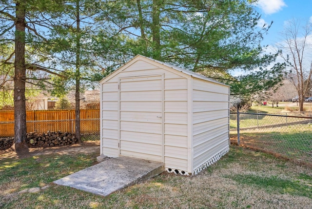 view of shed with a fenced backyard