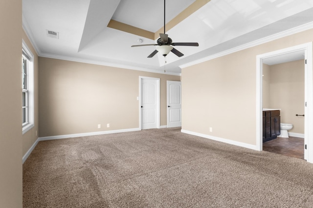 carpeted empty room featuring visible vents, baseboards, crown molding, and a ceiling fan