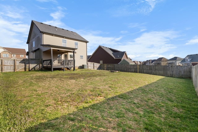 view of yard featuring a fenced backyard and a wooden deck