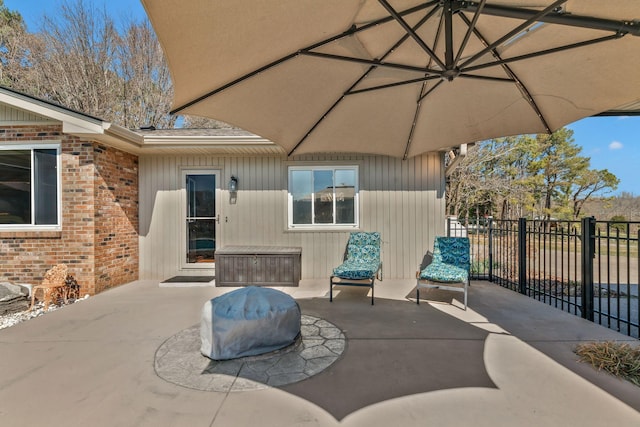 view of patio / terrace featuring fence